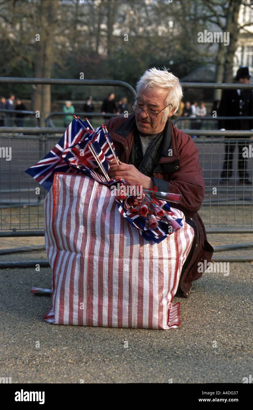 A man selling flags during the Queen Mother's funeral procession,  London, UK Stock Photo