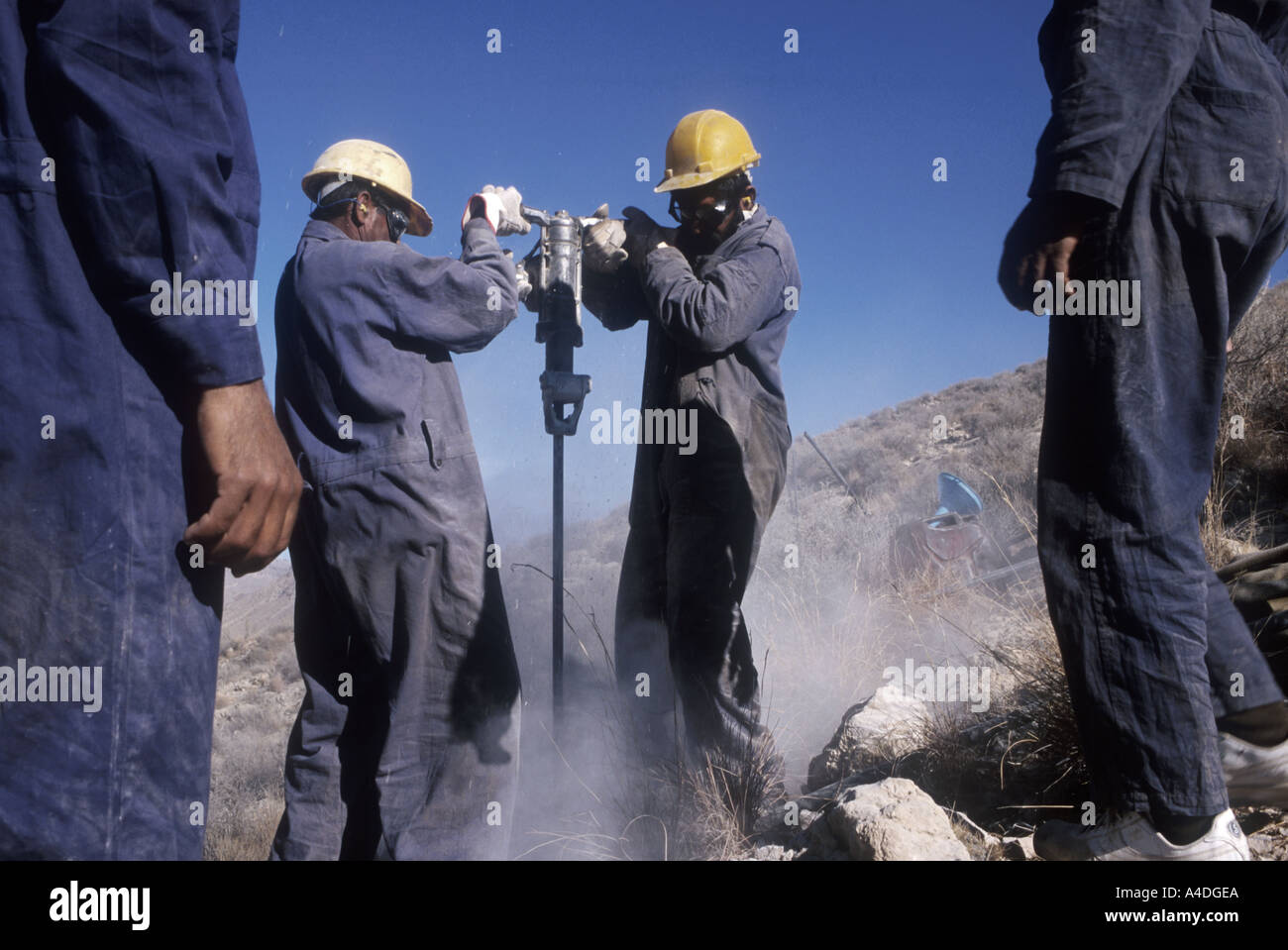 Seismic survey teams drilling lines to survey the  land for gas and oil. Baluchistan, Pakistan Stock Photo