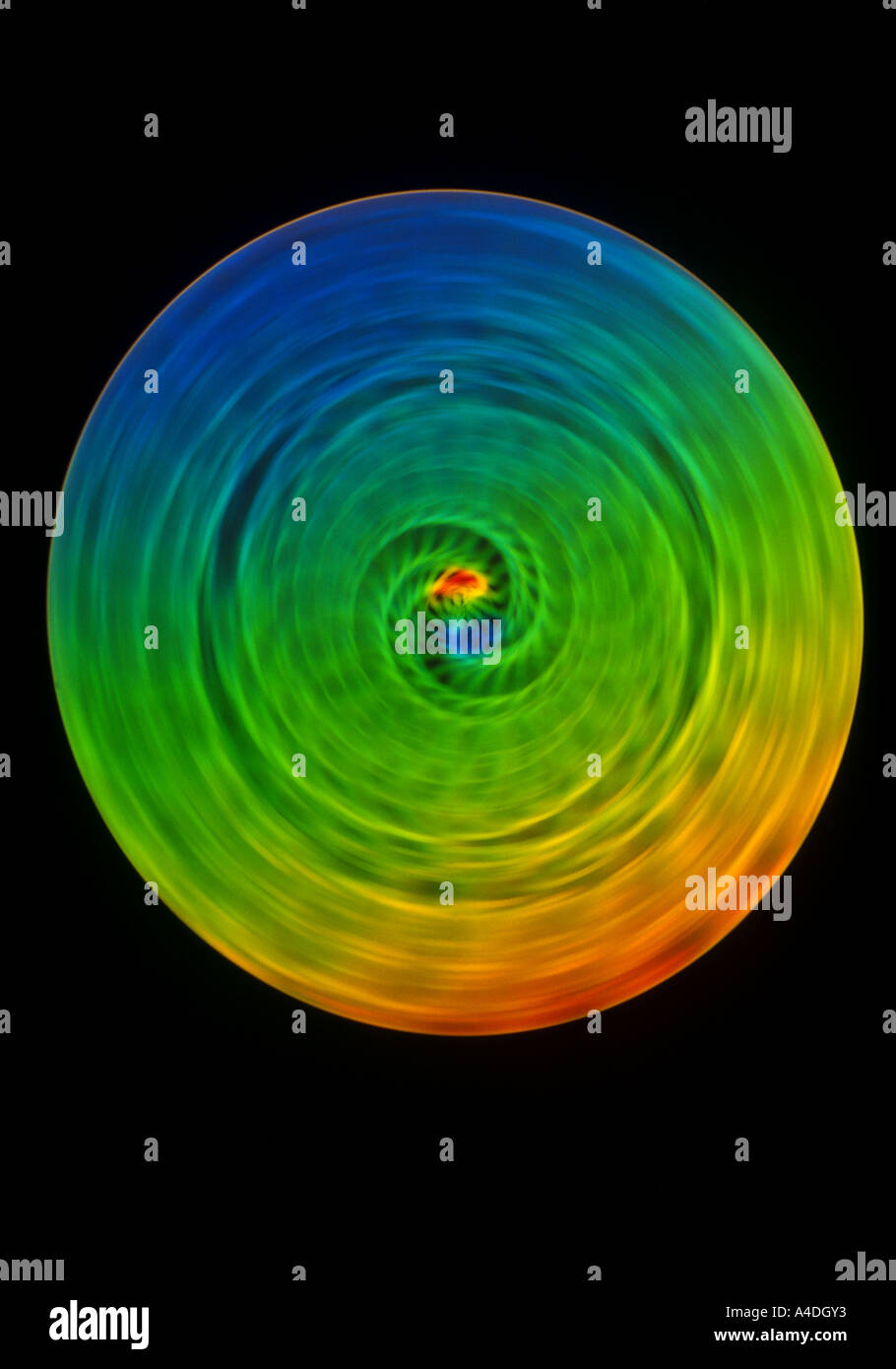 Interference colours appear on a spinning disc caused by light ...