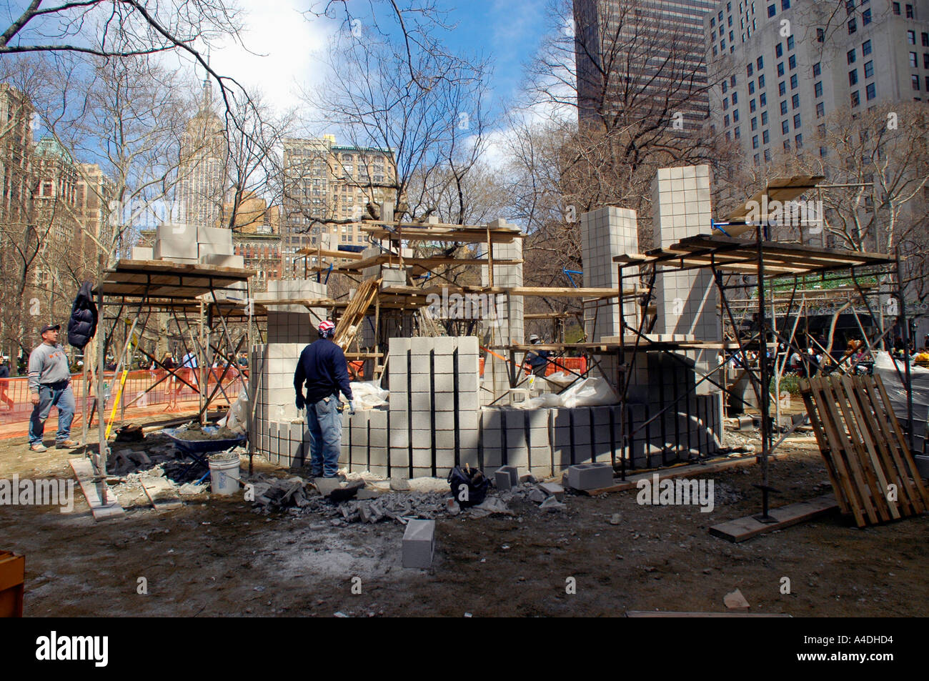 Workers in Madison Square Park construct Sol Lewitt s Stone House The sculpture is a site specific work of art and is part of the Art in the Park program Stock Photo