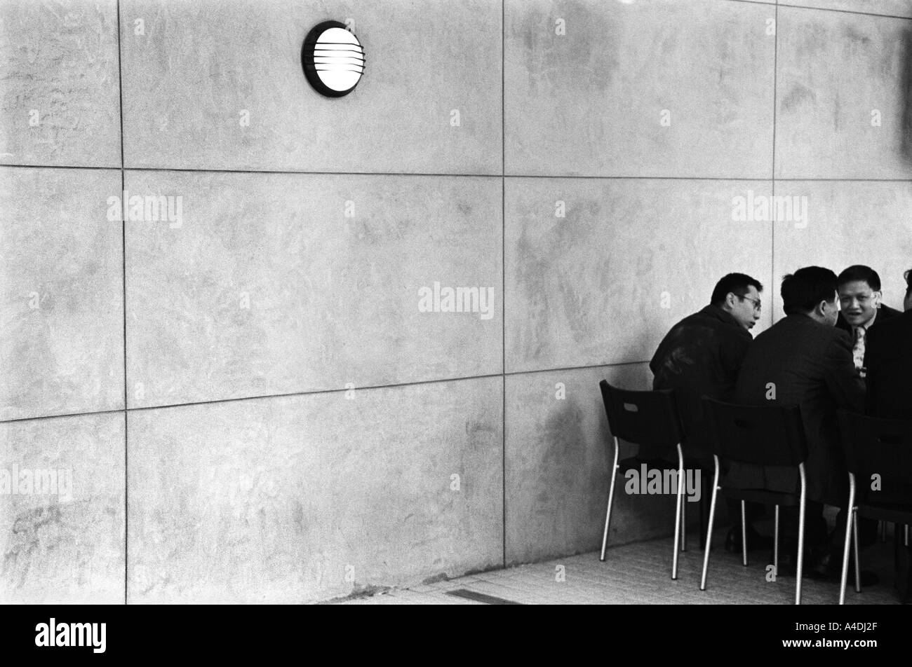 Businessmen in a meeting. Hong Kong, Peoples' Republic of China, HKSAR Stock Photo
