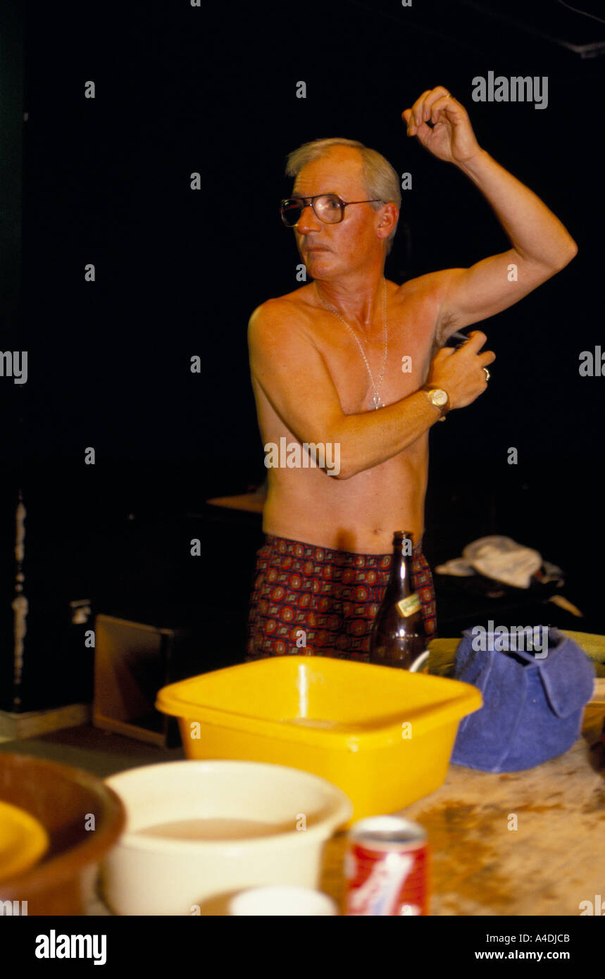 Sid Little putting on deodorant backstage 1992 Stock Photo