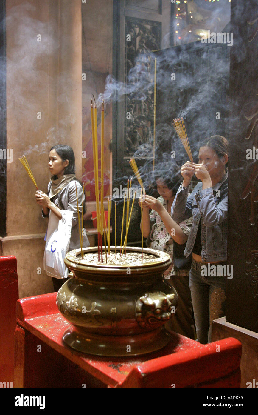 Praying with incense at The Jade Emperor Pagoda. Saigon,  Vietnam Stock Photo