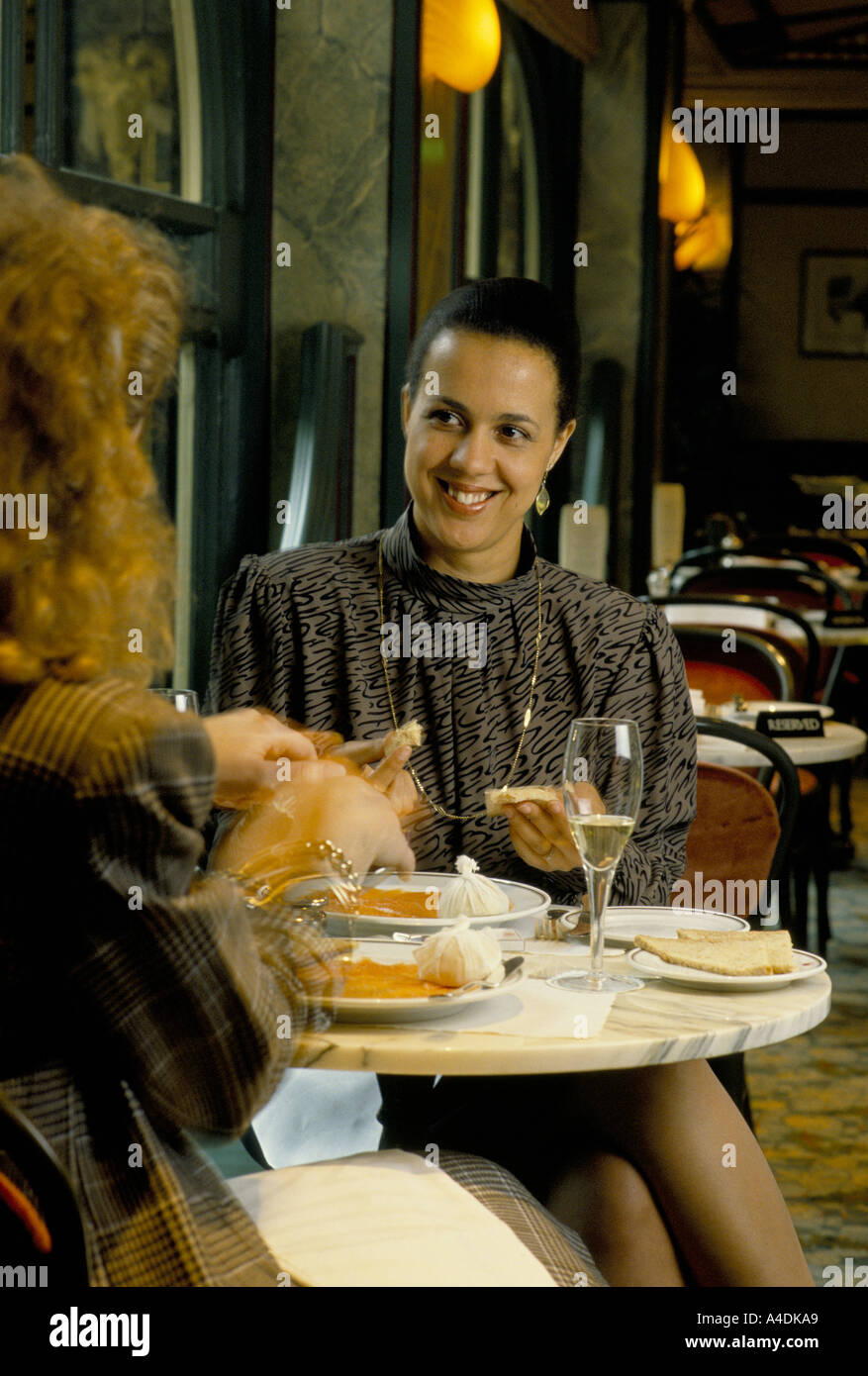 Women eating lunch at the Savoy Restaurant Bar, London, UK Stock Photo