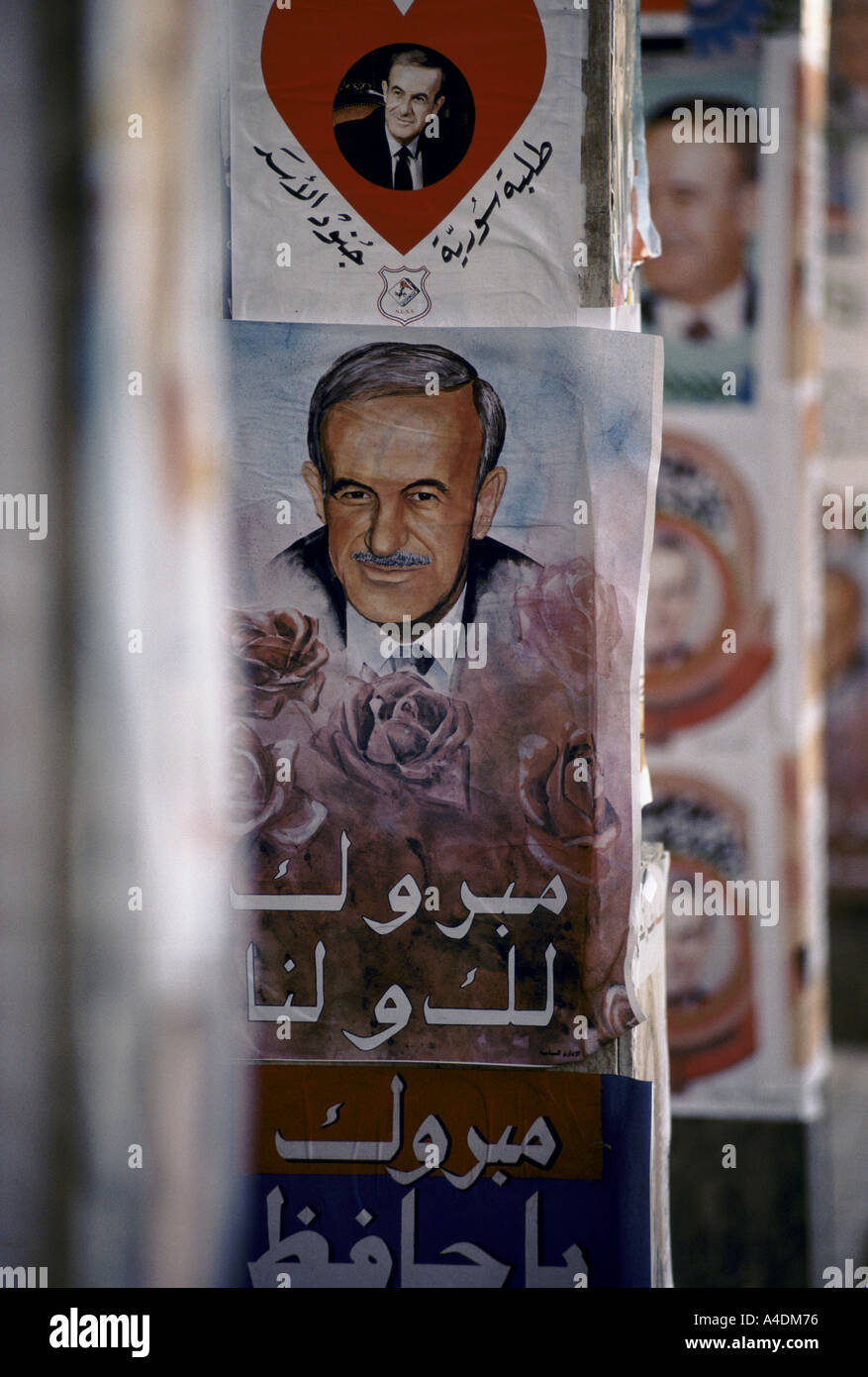 The personality cult of Assad. Posters with love hearts & photos of  Assad during the referendum campaign, Damascus,  Dec 1991 Stock Photo
