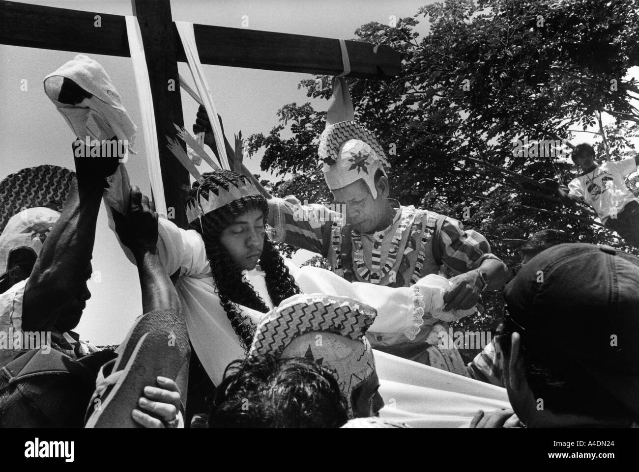 A penitant being taken down from his cross after crucifixion. Stock Photo