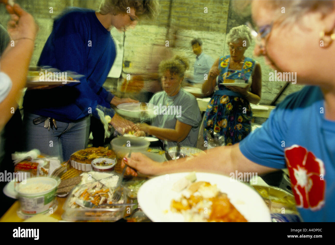 People eating food, Bradwell, Derbyshire Stock Photo