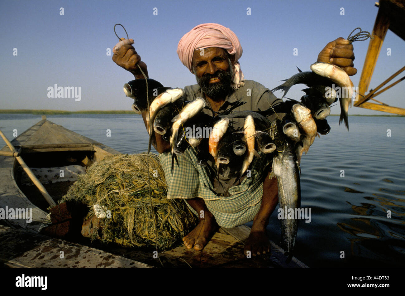 fisherman with catch lake manchar sind province pakistan april 1989 Stock Photo