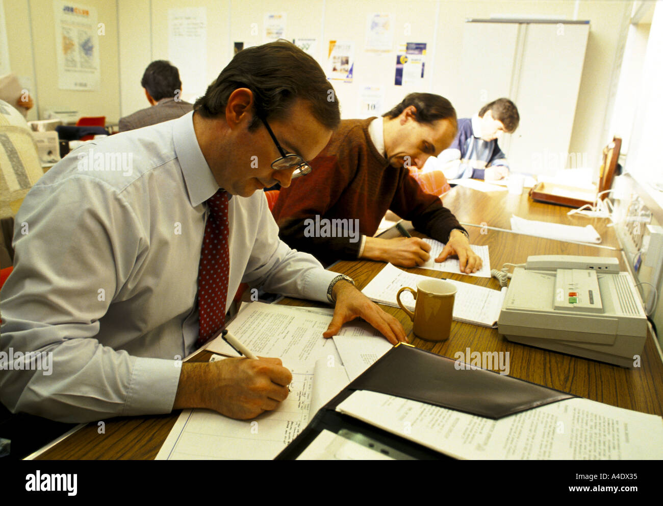 redundant businessmen searching for jobs at a swindon job club Stock Photo