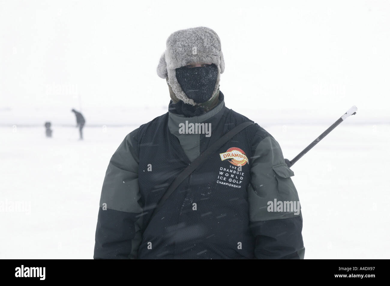 Polar bear spotter with rifle at the 2004 Drambuie ice golf championship in Svalbard, Norway. Stock Photo