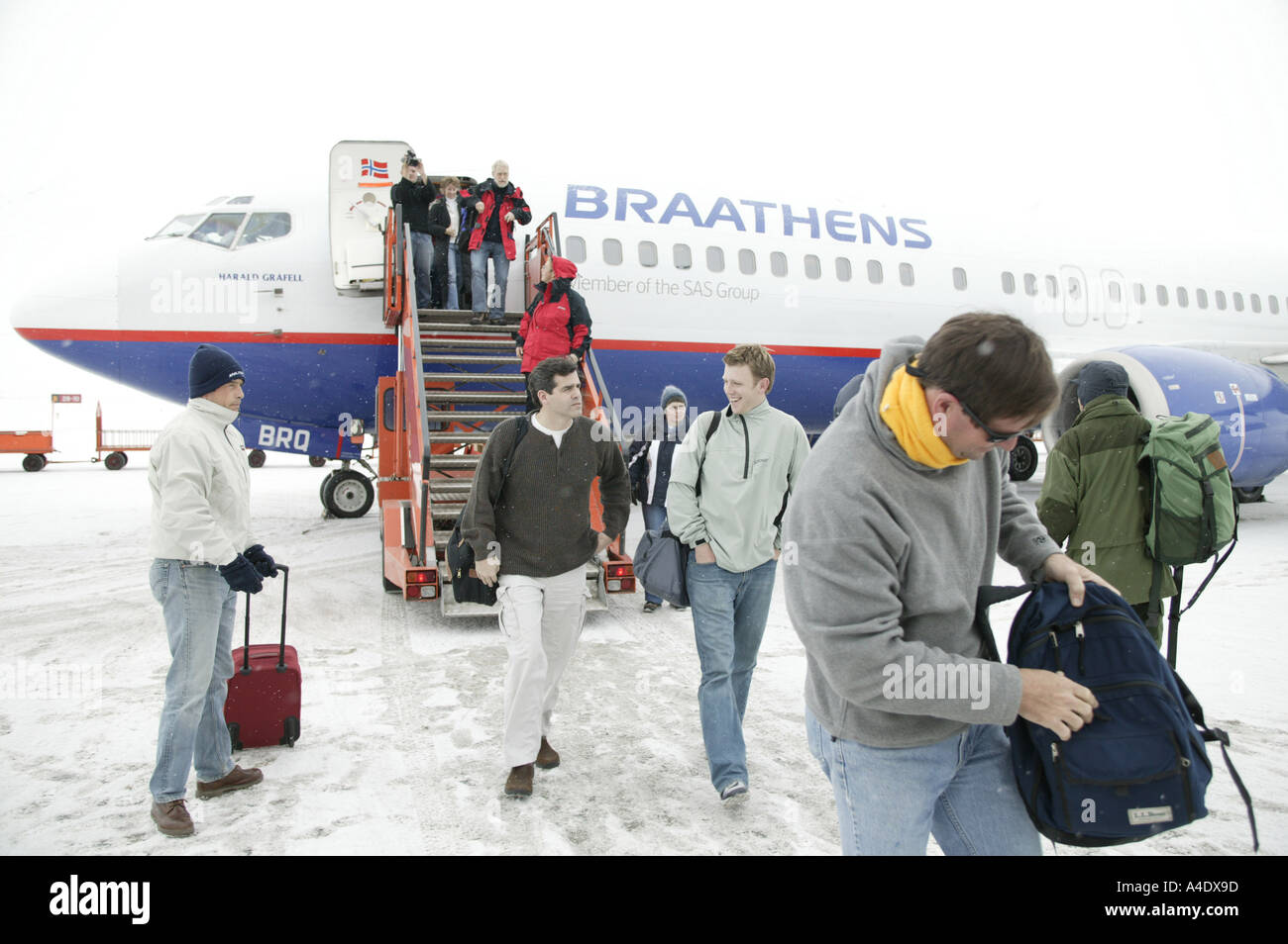 Competitors arriving by air for the 2004 Drambuie ice golf championship in Svalbard, Norway. Stock Photo