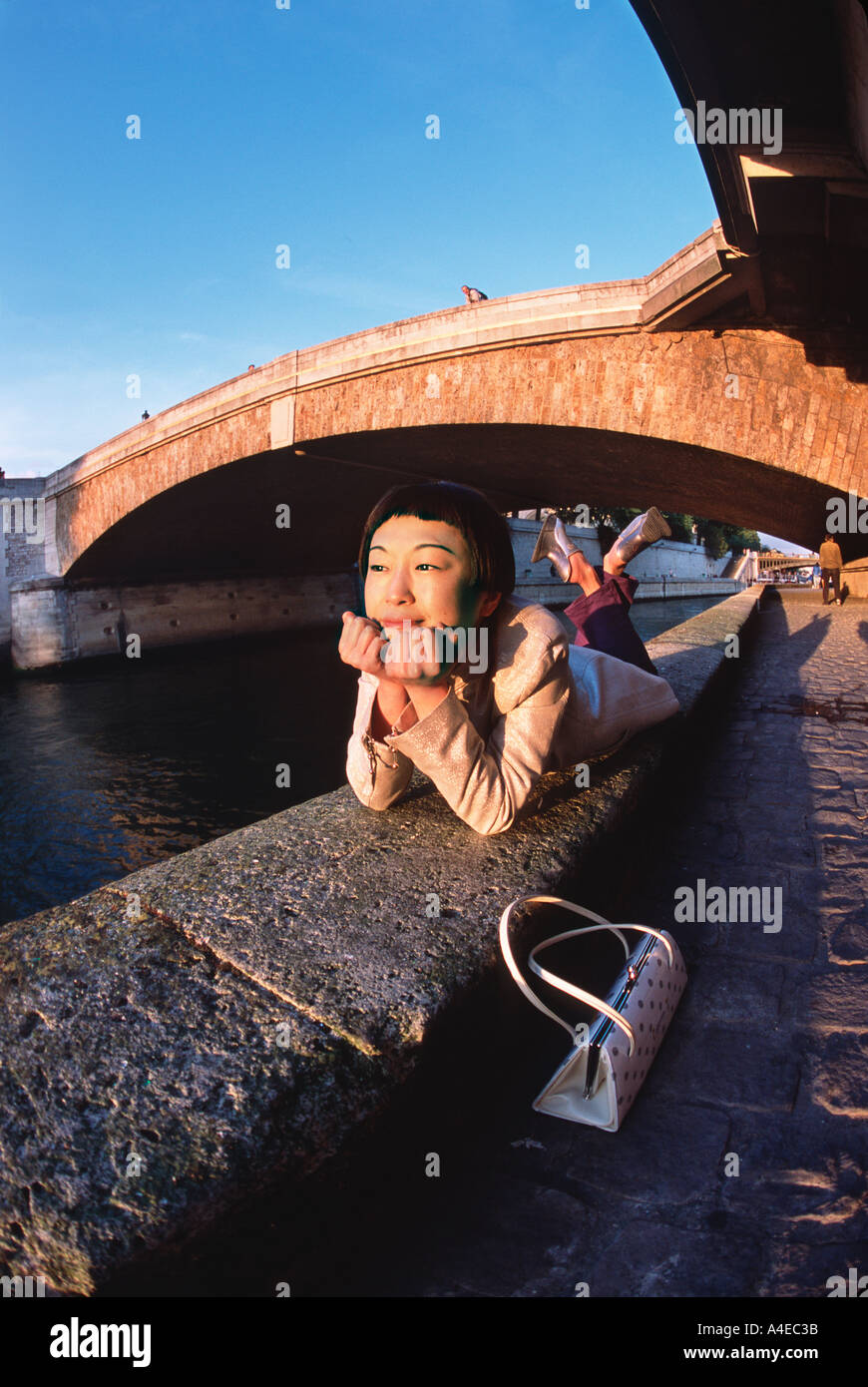 Young Japanese woman at La Seine Paris France Stock Photo