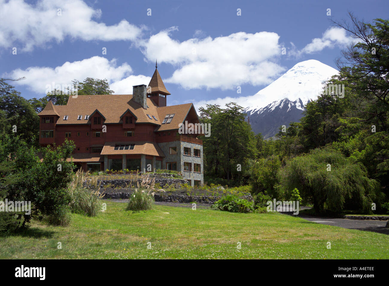 Hotel at Petrohue with Osorno Volcano behind on lake Lagos Todos los Santos Puerto Varas La Araucania Lake District Chile Stock Photo