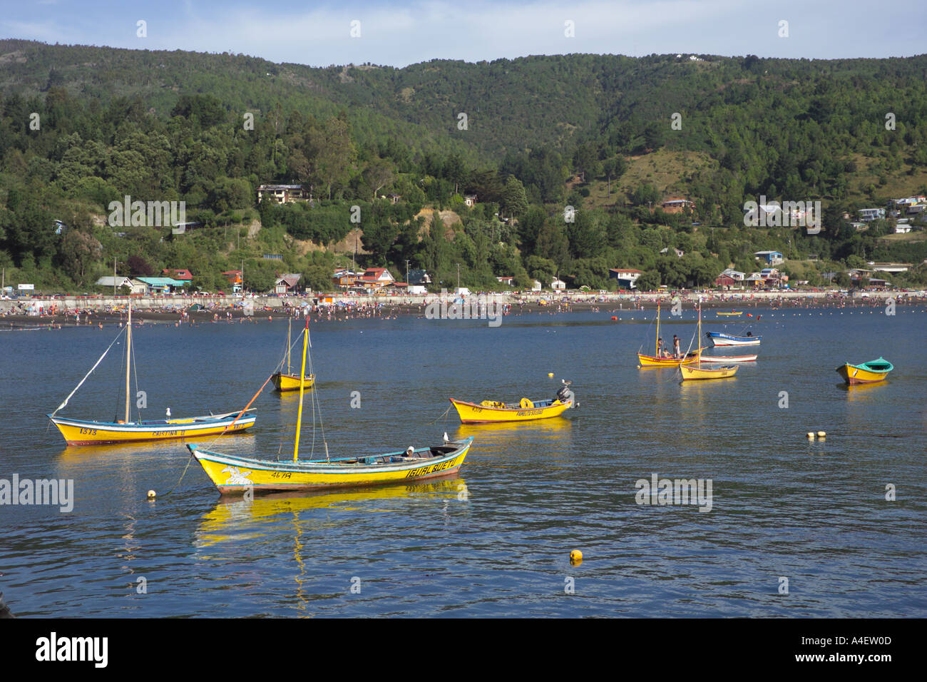 Fishing boats on Los Molinos Bay with the beach behind located near Valdivia La Araucania Lake District Chile Stock Photo