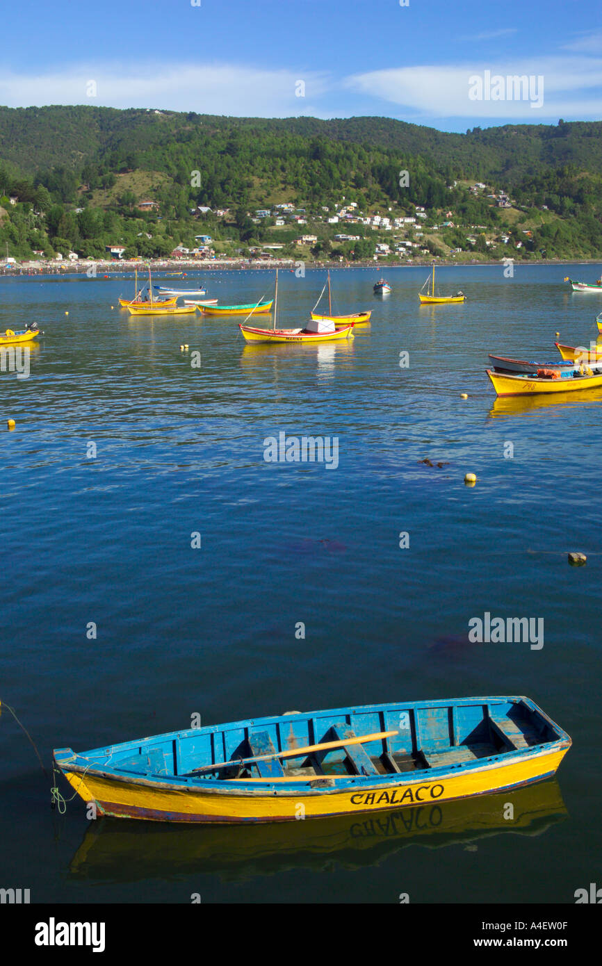 Fishing boats on Los Molinos Bay with beach behind located near Valdivia La Araucania Lake District Chile Stock Photo