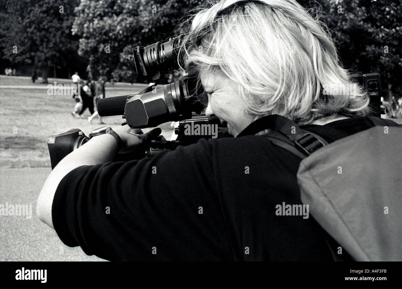 TV camera woman on the anniversary of Princess Dianas death Kensington Palace Gardens London Stock Photo