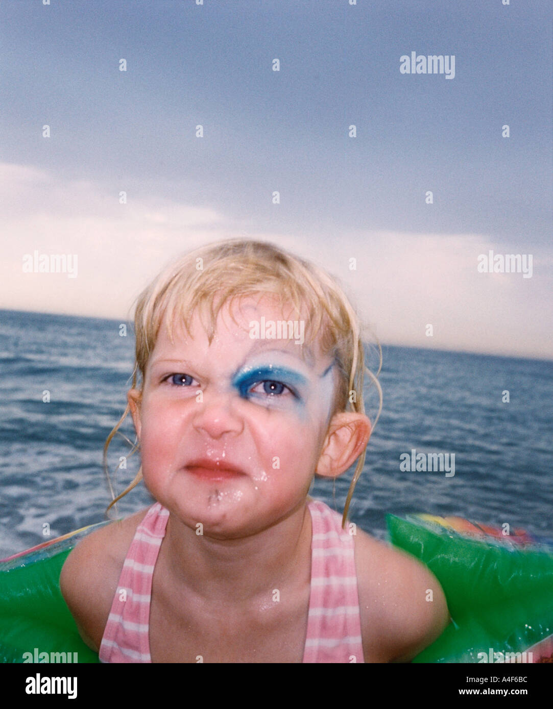 Bathing girl with a tattoo around her eye Stock Photo Alamy