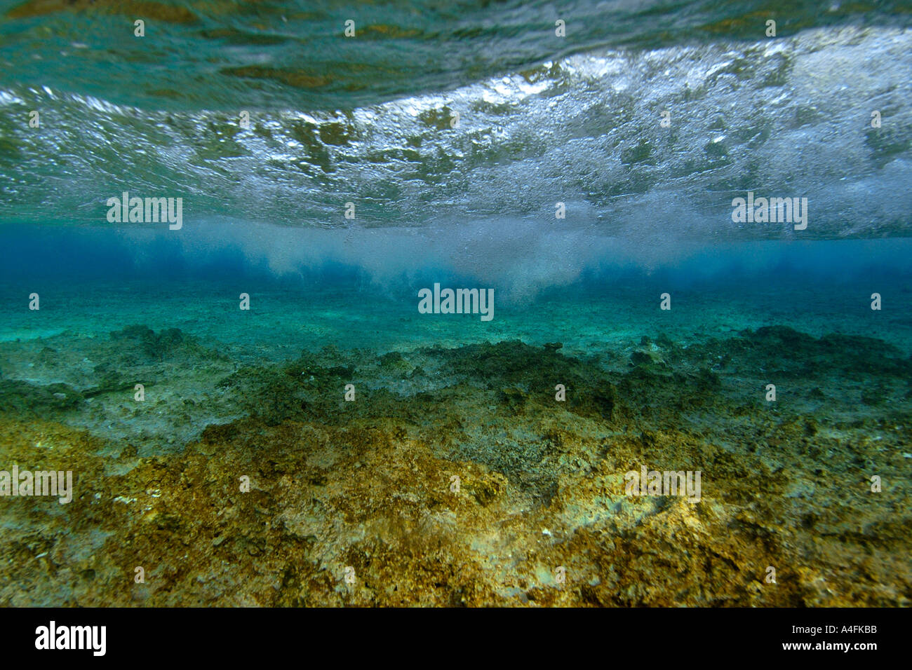 Sea floor and wave breaking Majikin island Namu atoll Marshall Islands N Pacific Stock Photo