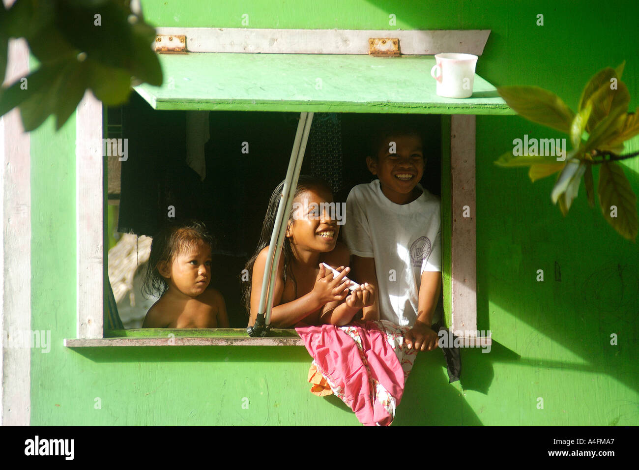 Marshalhese children on window Majikin island Namu atoll Marshall Islands N Pacific Stock Photo