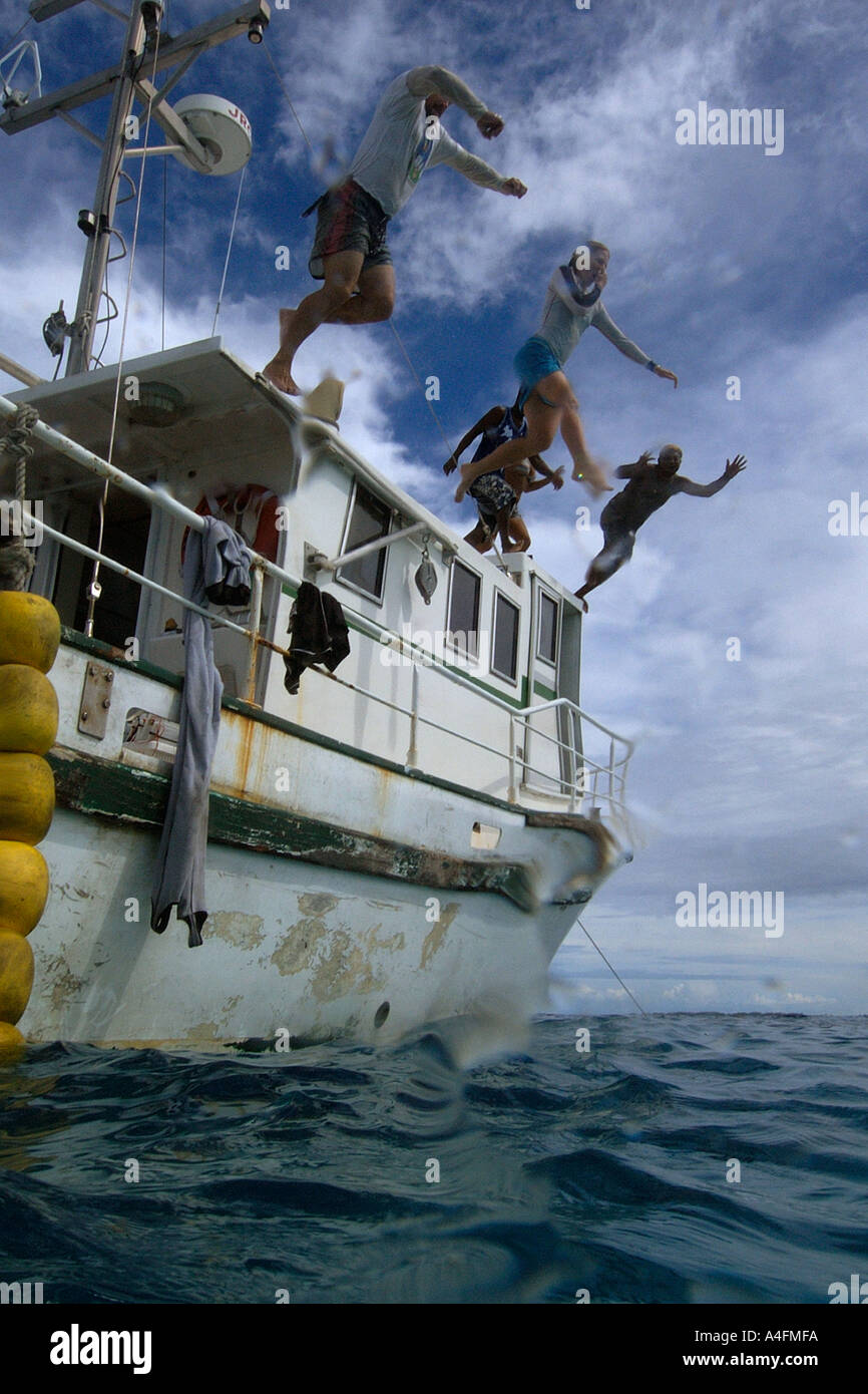 Jumping off the ship Namu atoll Marshall Islands N Pacific Stock Photo