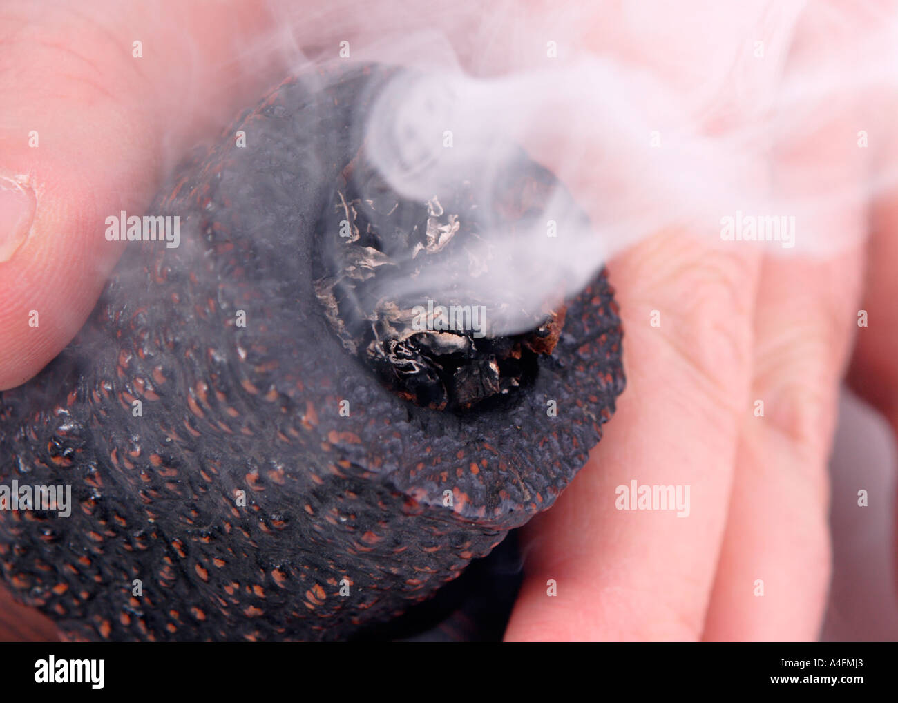 A pipe being lit Stock Photo Alamy