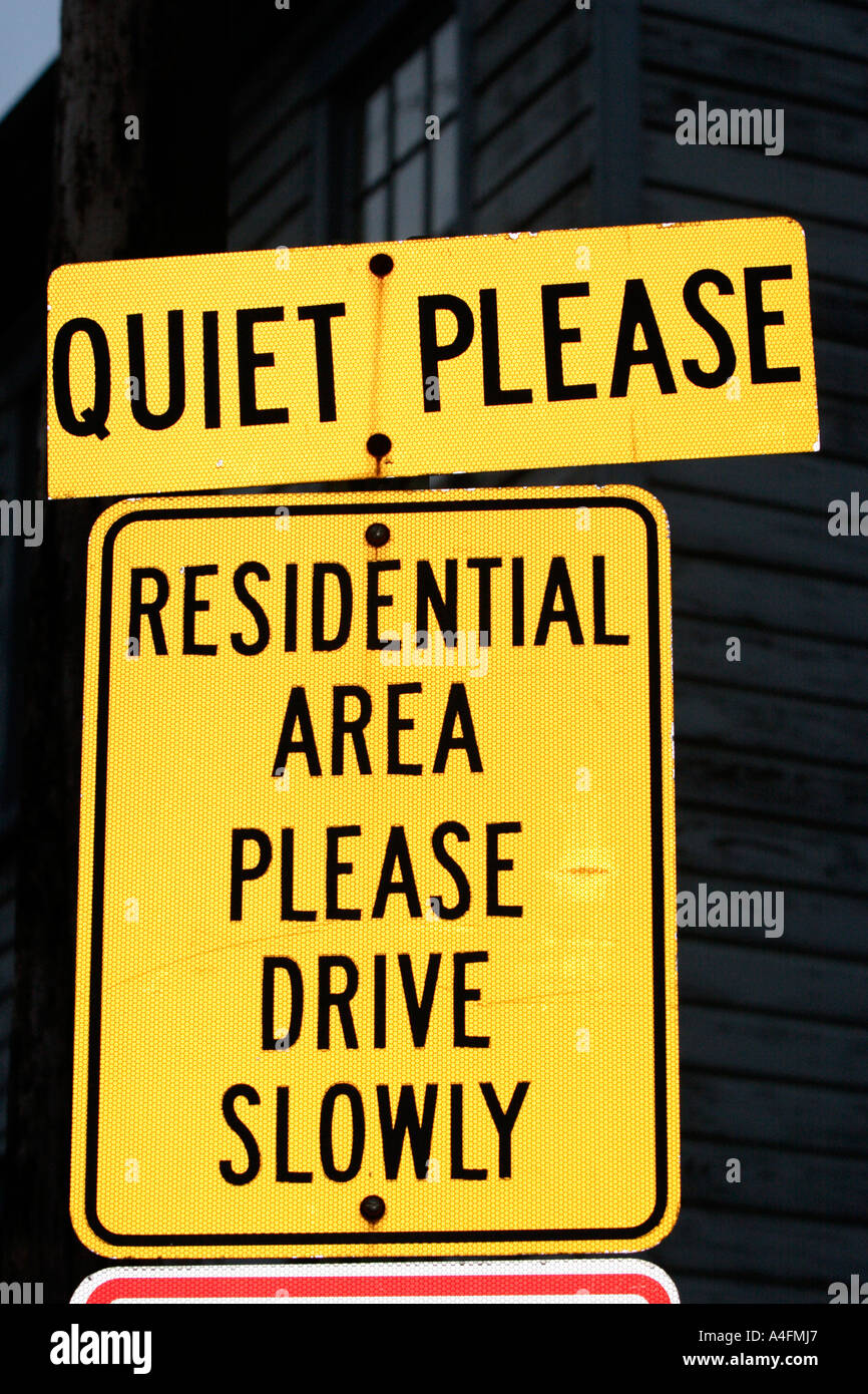 Quiet Please Residential Area Please Drive Slowly sign Stock Photo