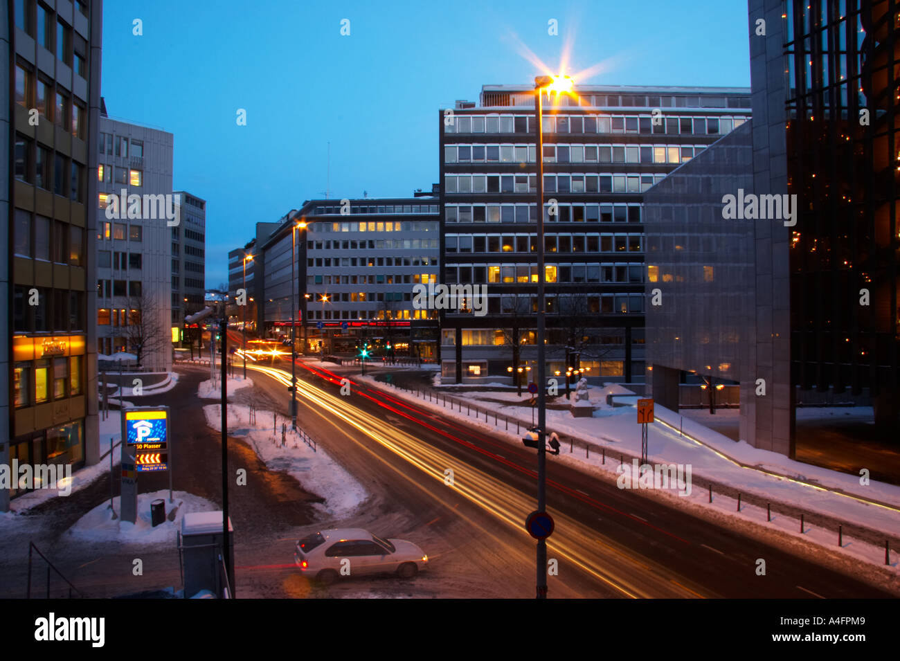 Norway, Oslo, Oslo City. Traffic trails running through a cityscape scene of Oslo City, in the Oslo region, captured at dusk. Stock Photo