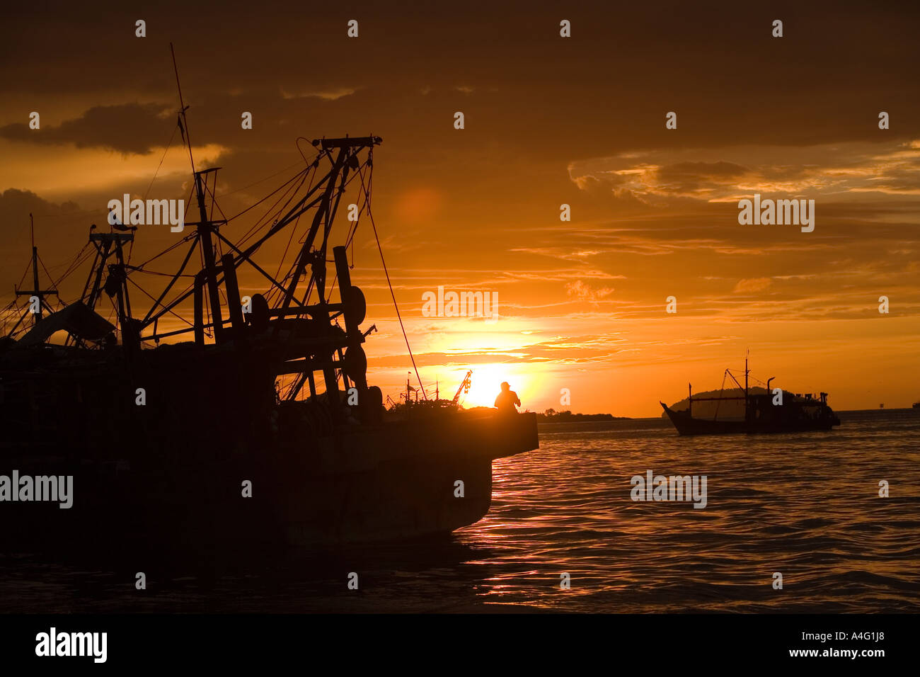 Malaysia Borneo Sabah Kota Kinabalu South China seafront fishing boats sunset Stock Photo