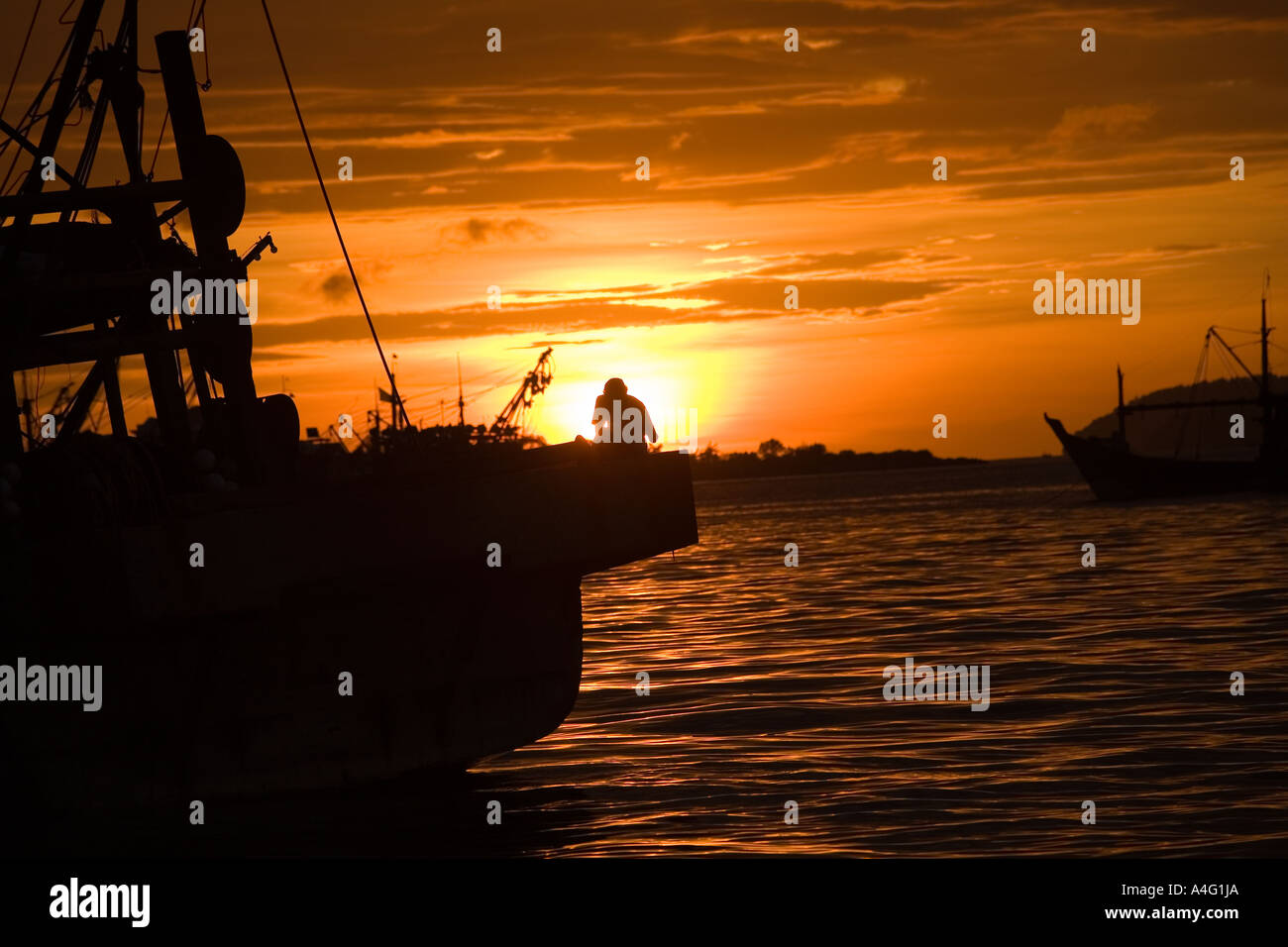 Malaysia Borneo Sabah Kota Kinabalu South China seafront fishing boats sunset Stock Photo