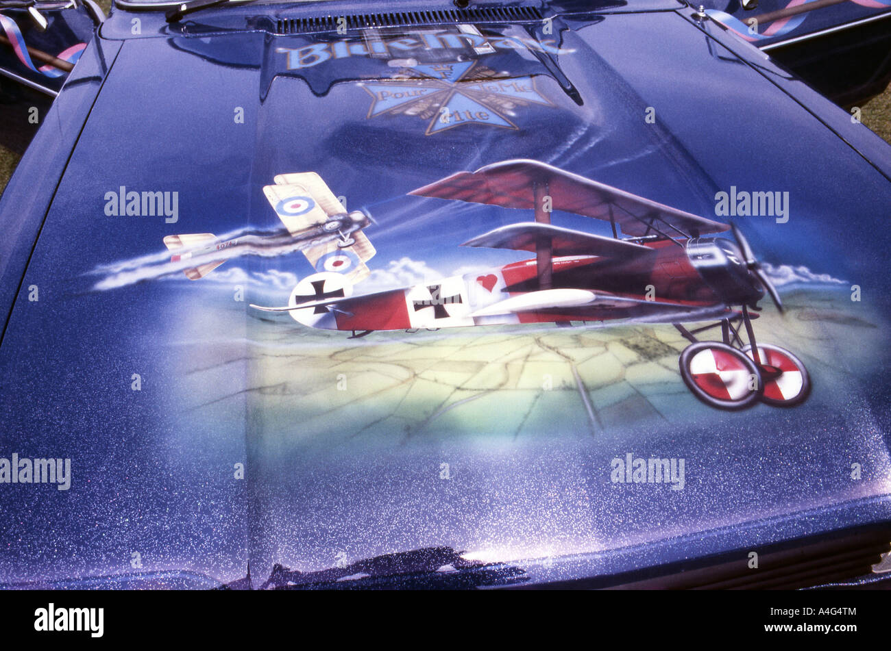 Car parked overlooking the Hams Fork River, Wyoming with two fly fishing  rods resting on the bonnet or hood on a cloudy day Stock Photo - Alamy