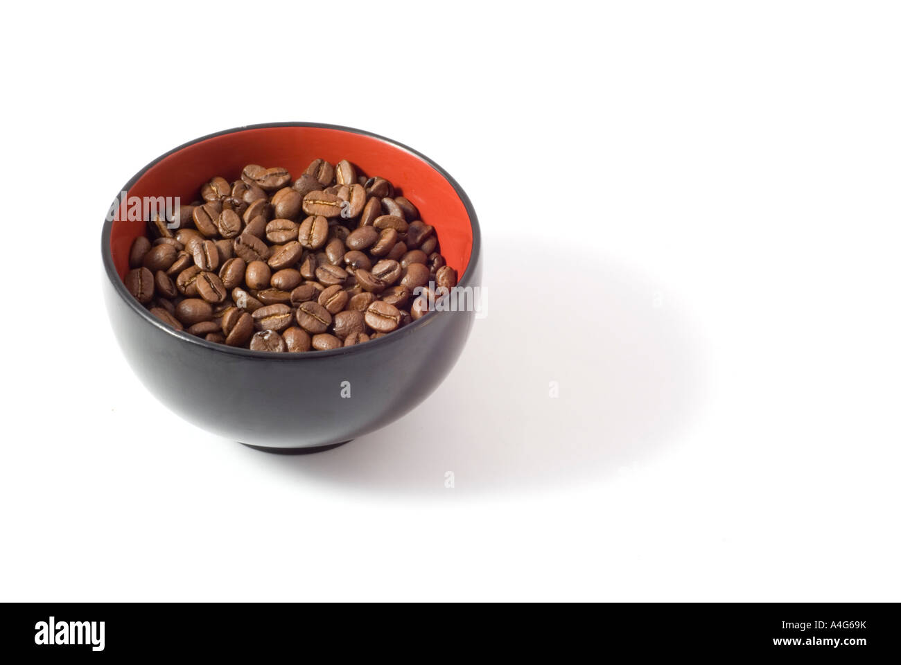 coffee beans in bowl isolated on white background Stock Photo - Alamy