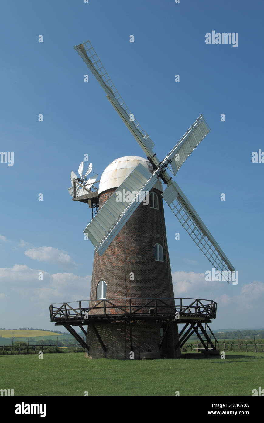 Restored Victorian historical Wilton windmill building with fantail & brick tower mill built 1821 between Wilton & Great Bedwyn Wiltshire England UK Stock Photo