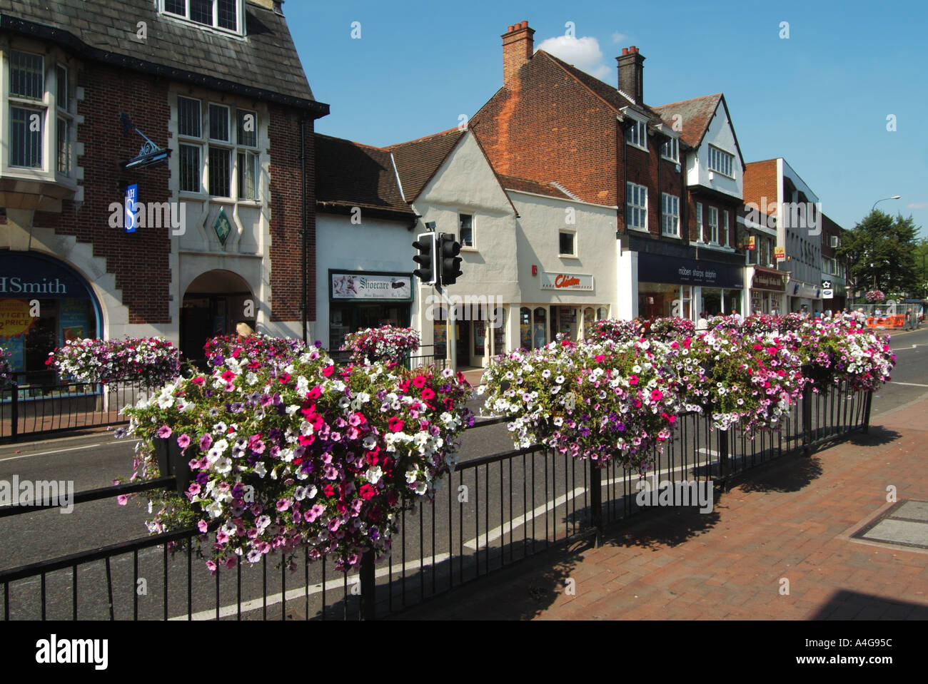 Brentwood High Street Shopping Area With Floral Display On Railings brentwood-high-street-shopping-area-with-floral-display-on-railings