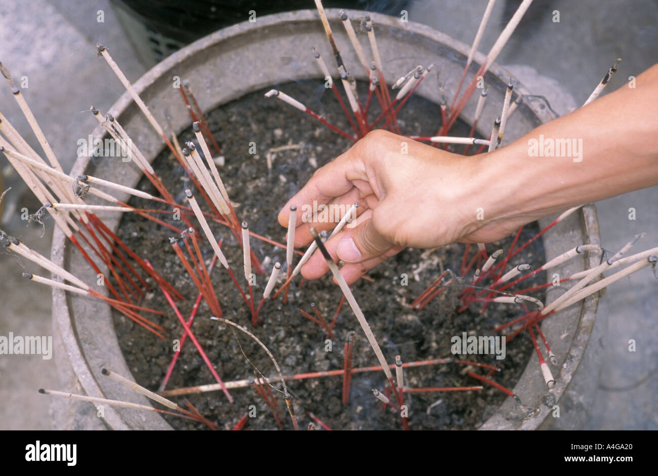 Buddhist burning incense hi-res stock photography and images - Alamy