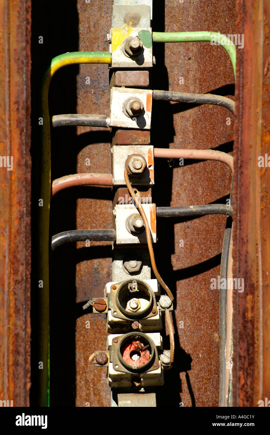 Electric wires three phases and missing fuse in corroded street light