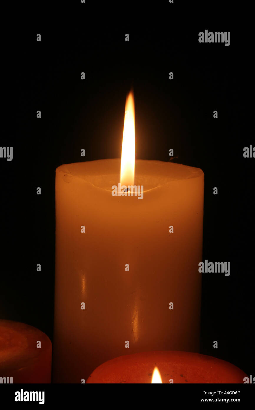 Candles burning in the darkness Stock Photo Alamy