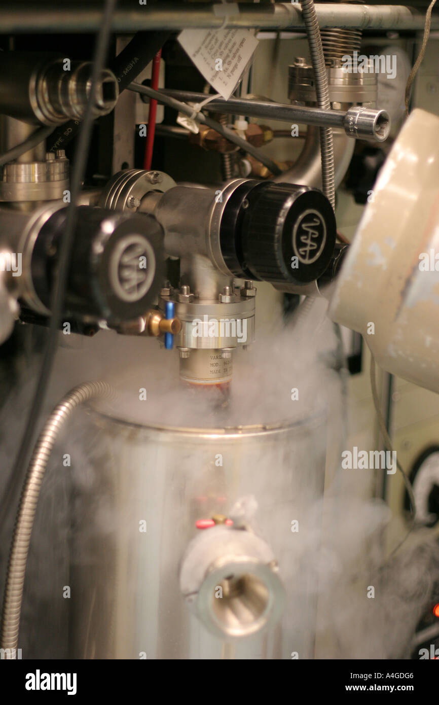 Pouring liquid nitrogen into a pump for a molecular beam epitaxy system, at the University of