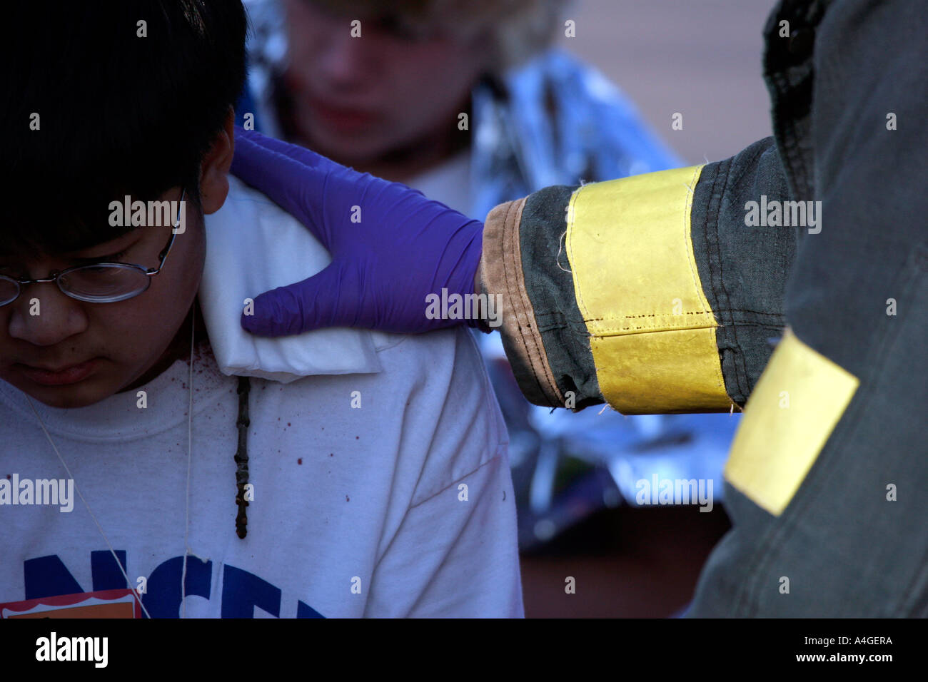 ems-worker-with-hand-on-teenager-boy-who-is-hurt-stock-photo-alamy