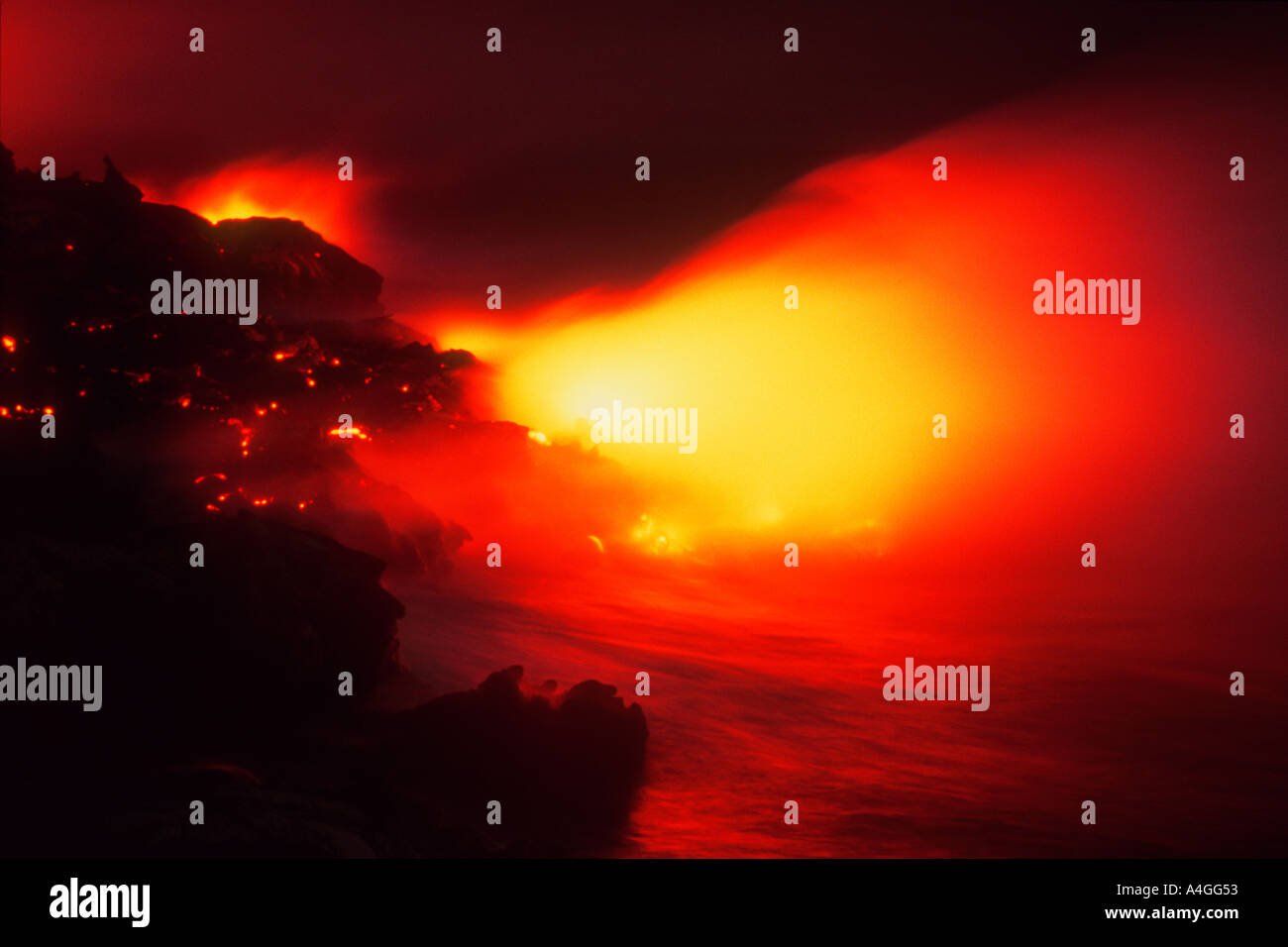 Lava flowing into Pacific Ocean at Night Hawaii Volcanoes National Park Big Island Hawaii U S A Stock Photo