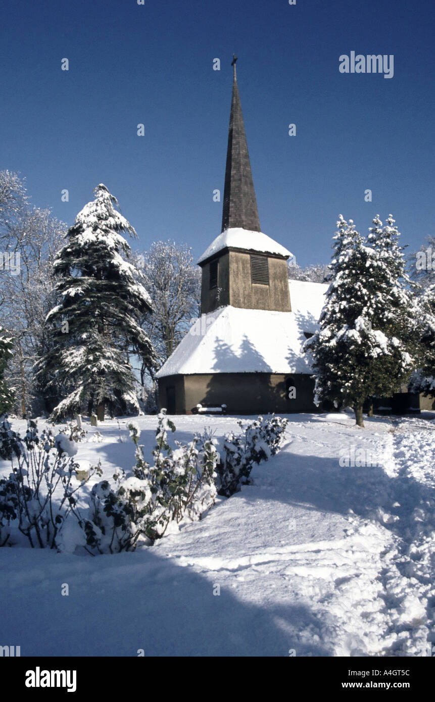Rural parish church after heavy snowfall Navestock Essex Stock Photo