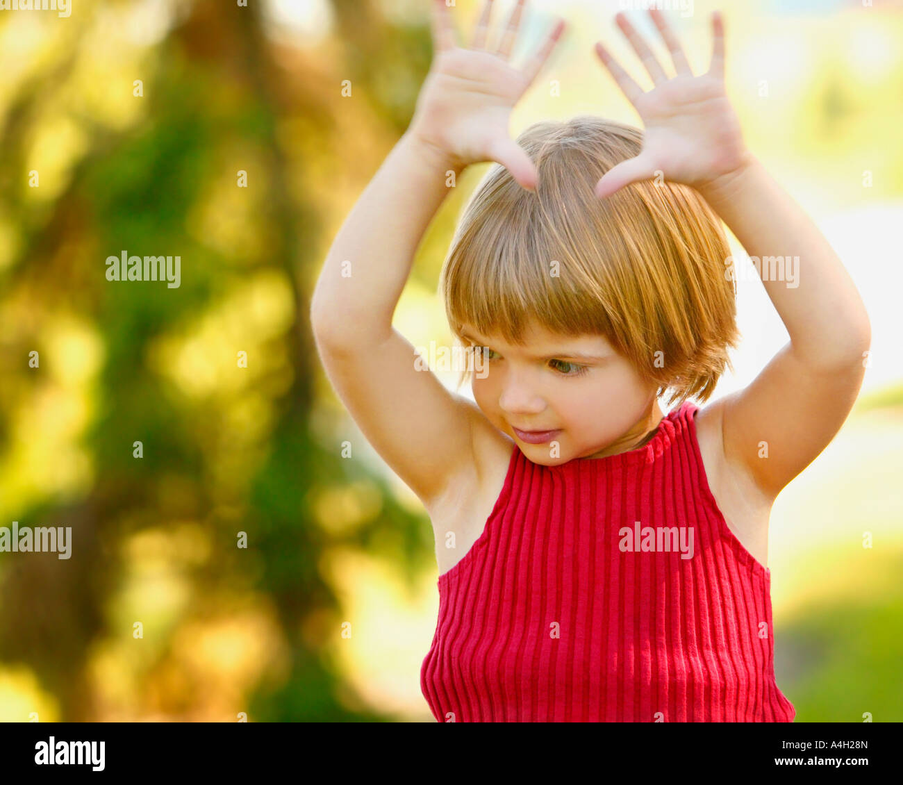Girl with her arms in the air Stock Photo