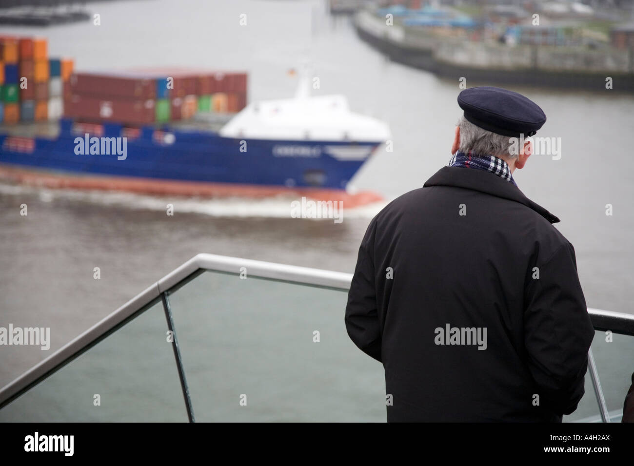 An old man is watching a ship, Hamburg, Germany Stock Photo
