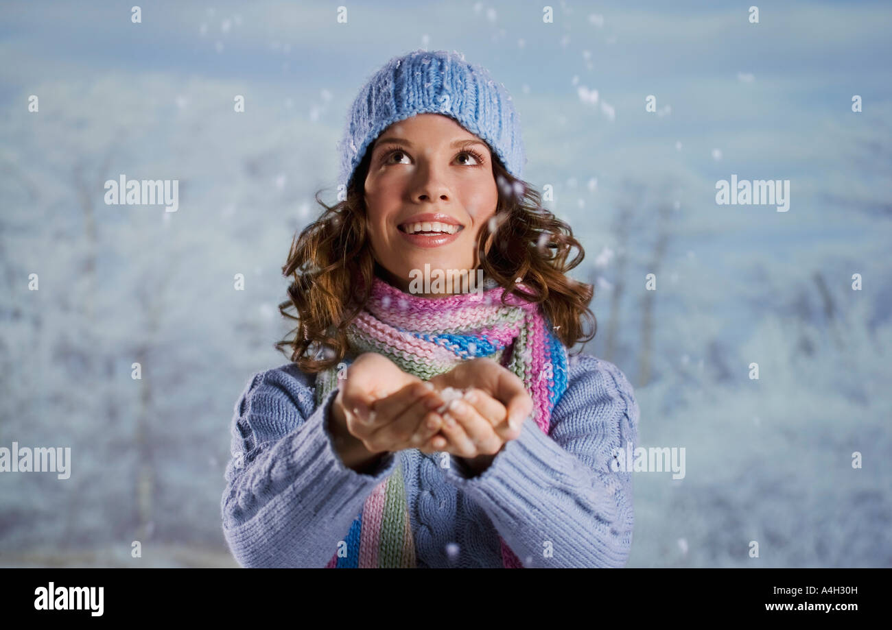 Woman catching snow Stock Photo - Alamy