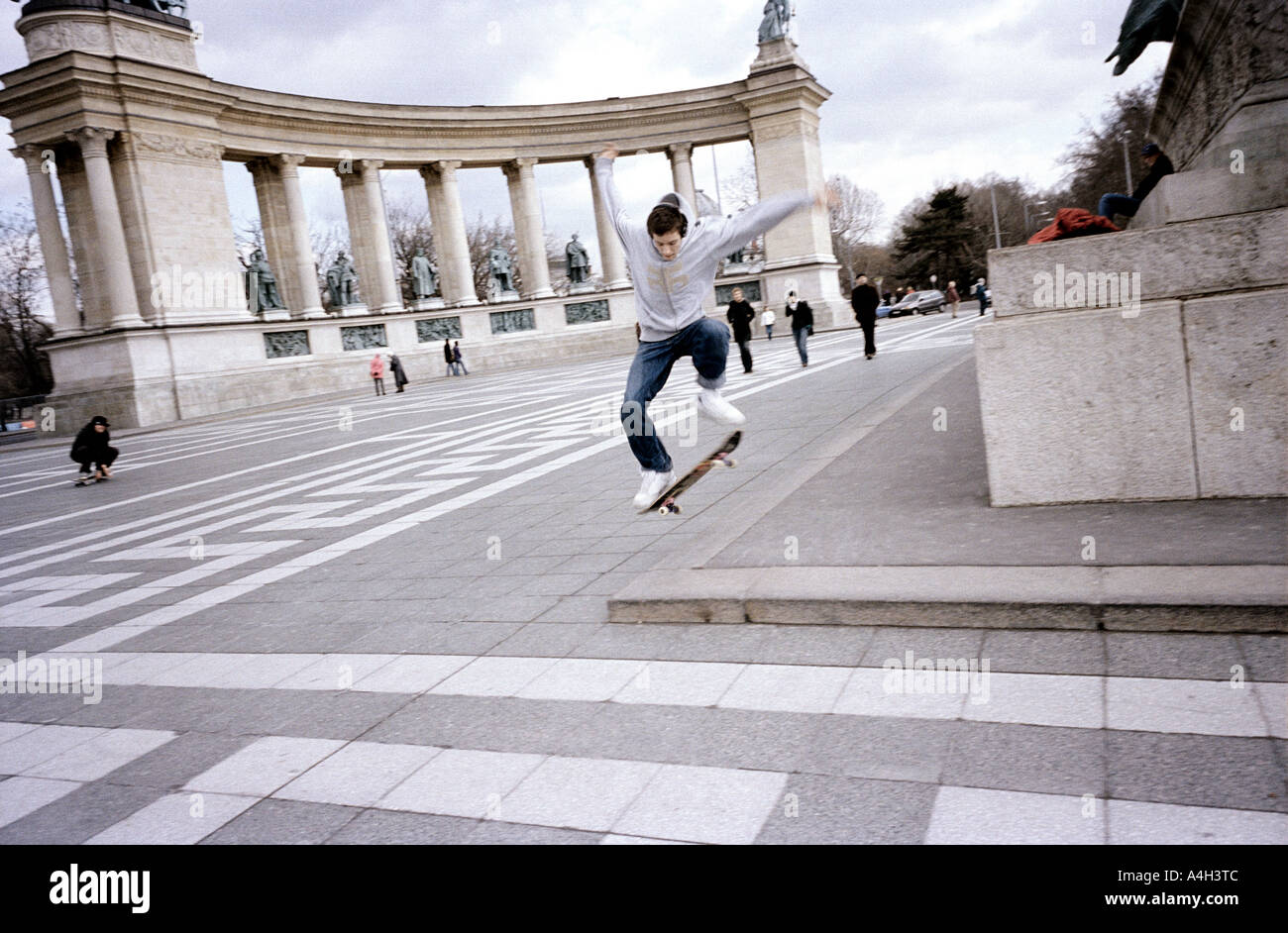 A teenage skateboarder at the Heroes' Square in Budapest, Hungary. Stock Photo