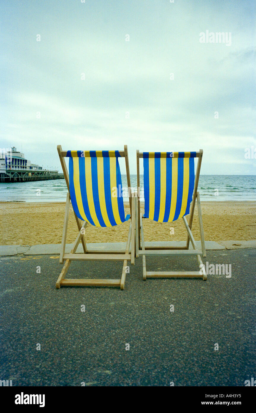 A pair of deckchairs by the beach Stock Photo