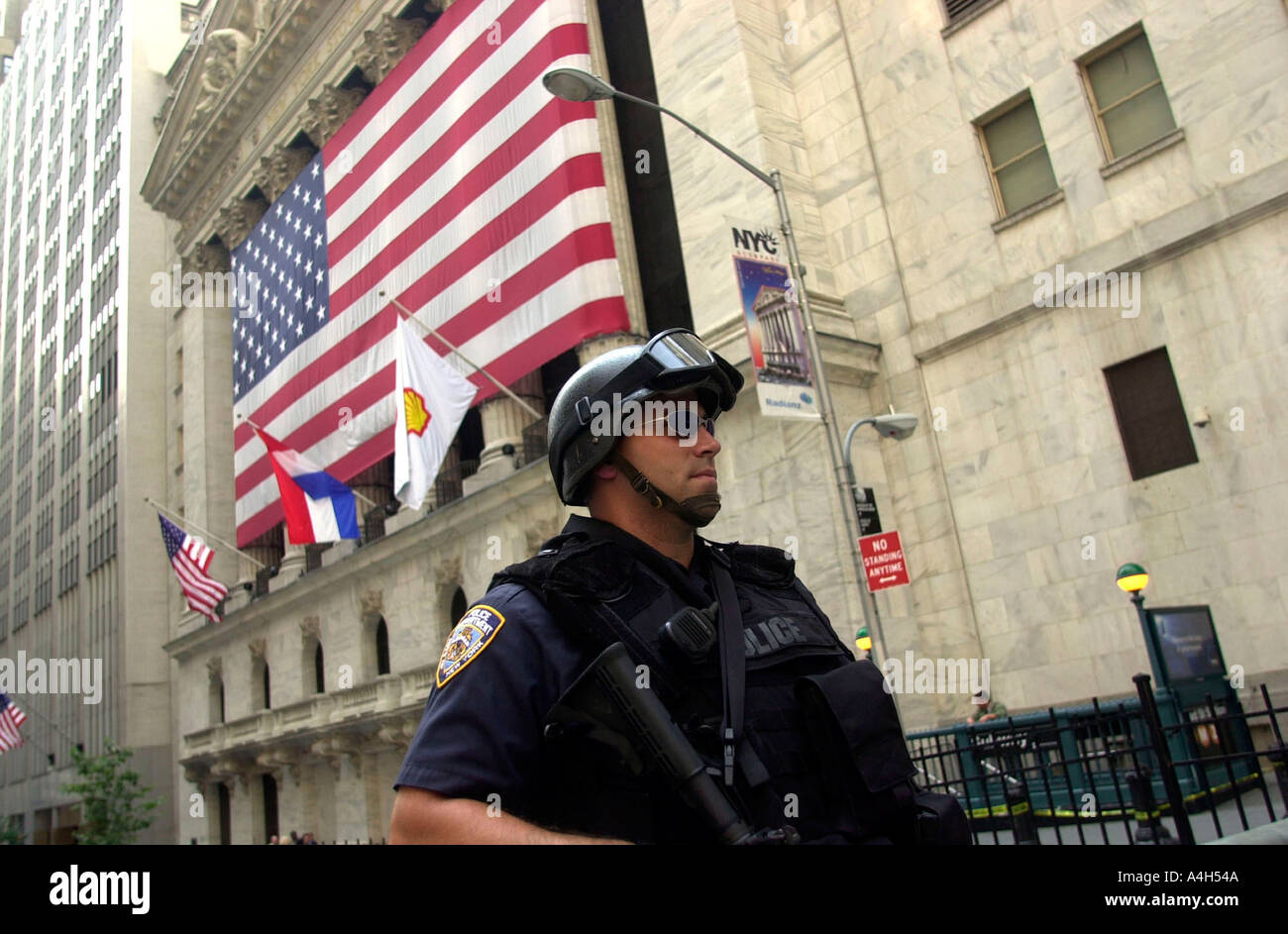 Heavily armed NYPD officers guard the New York Stock Exchange at Wall St  Stock Photo