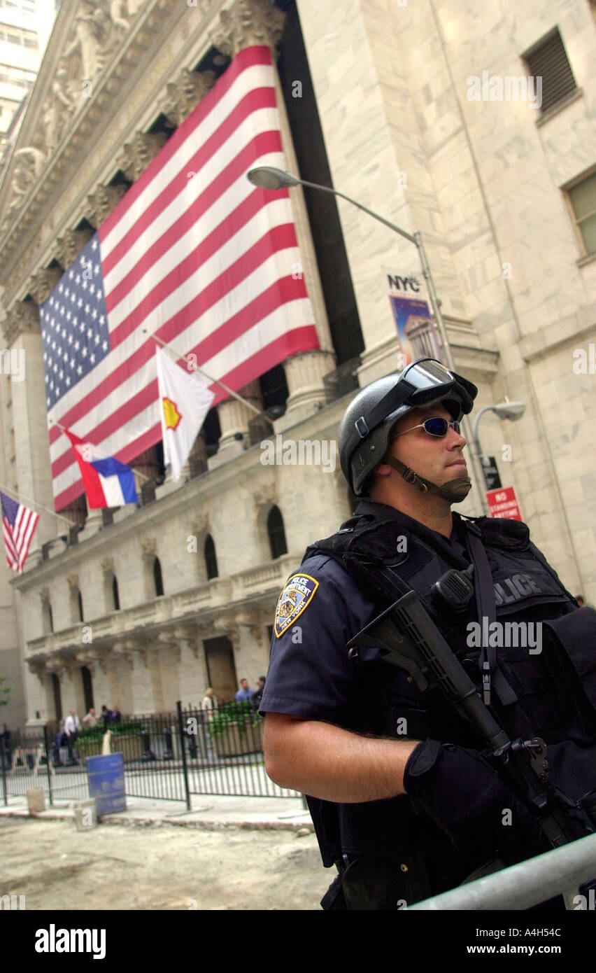 Heavily armed NYPD officers guard the New York Stock Exchange at Wall St  Stock Photo