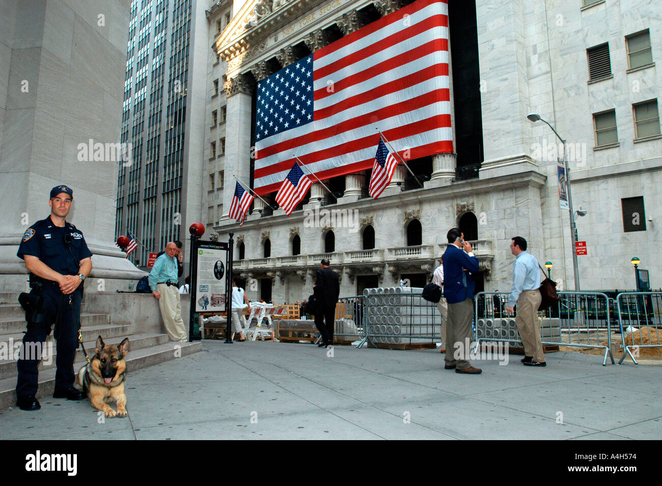 An NYPD officer with his canine partner stands guard at the New York ...
