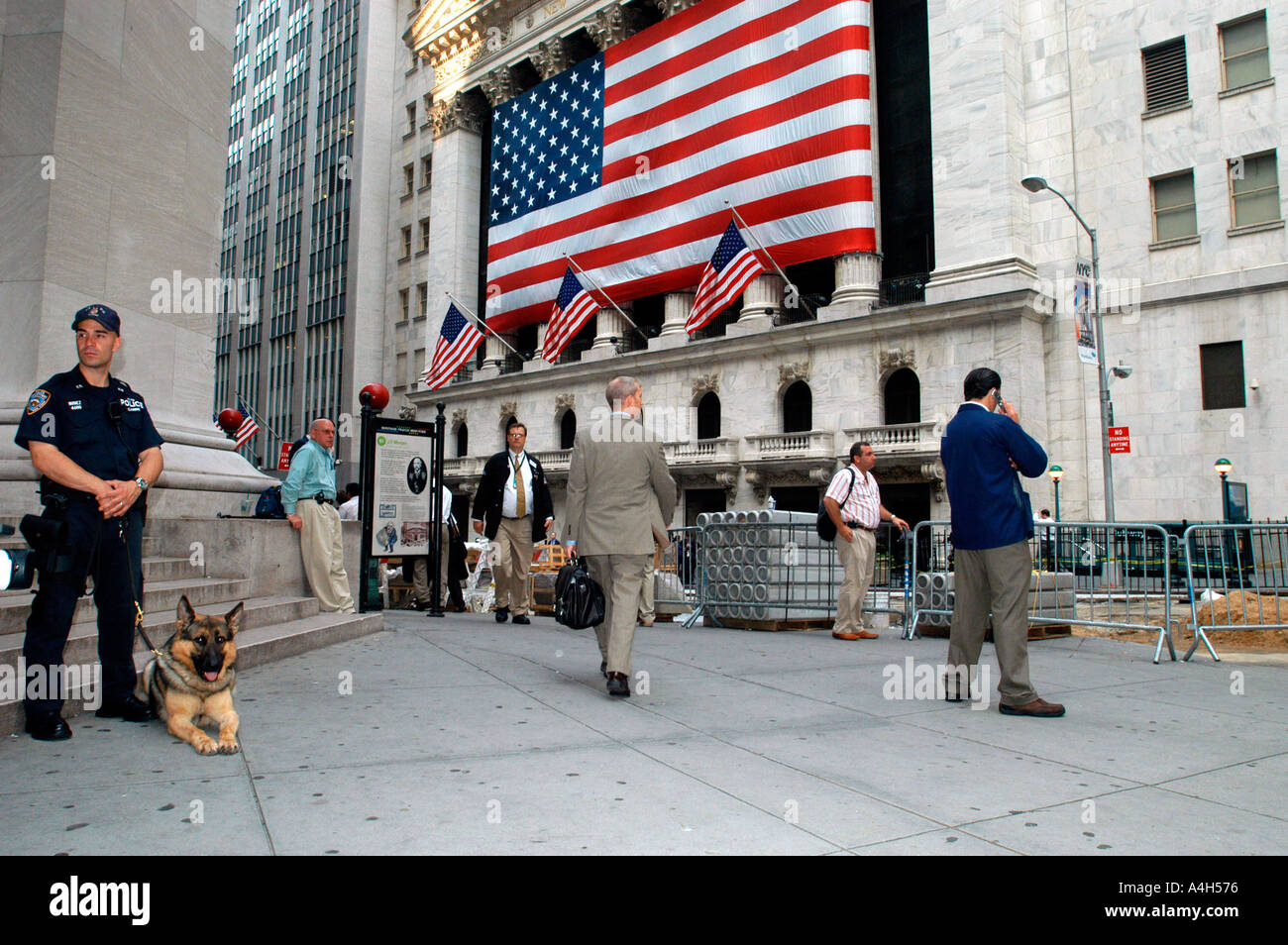 An NYPD officer with his canine partner stands guard at the New York ...
