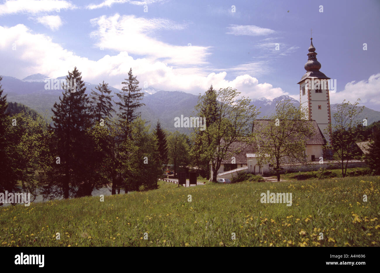 field with Church of St John the baptist at Ribcev laz Bohinj Slovenia ...